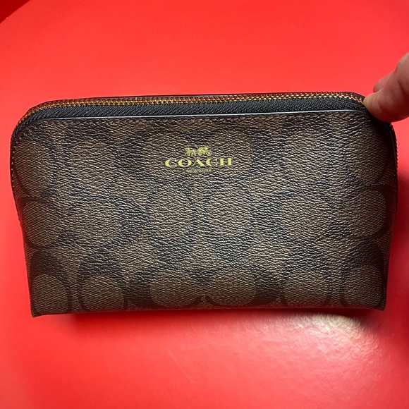 Coach Handbags - NWT brown makeup 💄 bag‼️